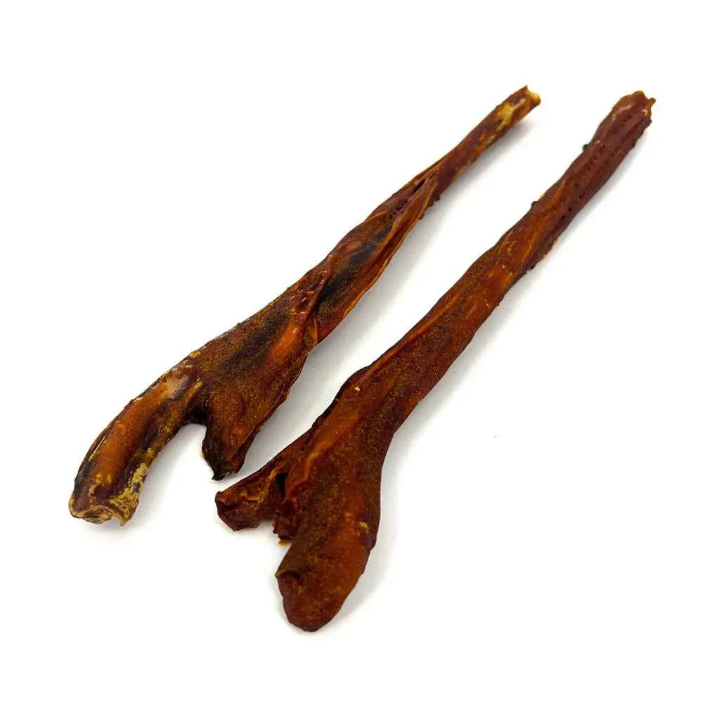 Two long, dark brown BarknBig Bullé Pumpkin Bully Sticks for dogs on a white background.