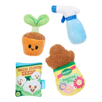 BARK Green Paw Starter Kit featuring plush toys like a plant, spray bottle, and seed packet for playful dogs