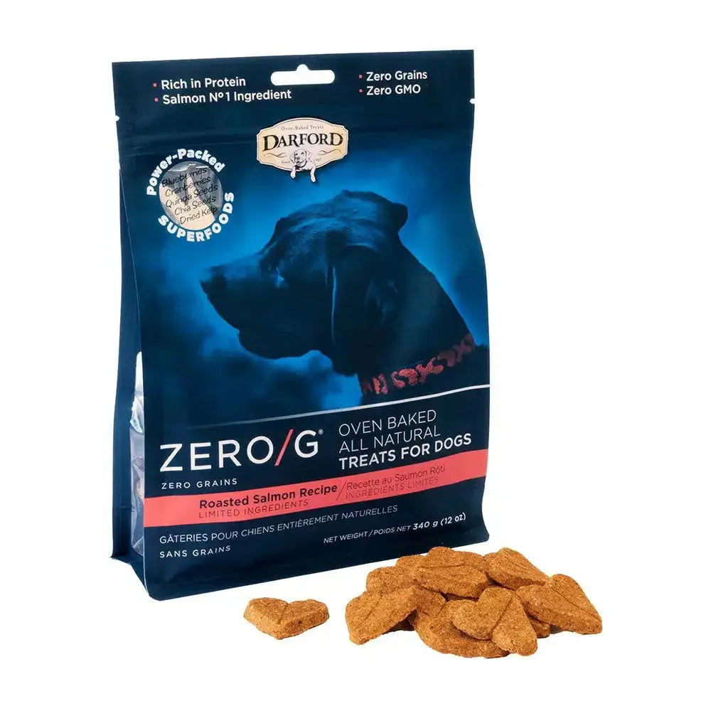 A blue and black bag of Darford® ZERO/G Roasted Salmon Oven Baked Dog Treats 12 Oz is shown with heart-shaped treats in front. The packaging highlights zero grains, rich protein content, and superfoods.
