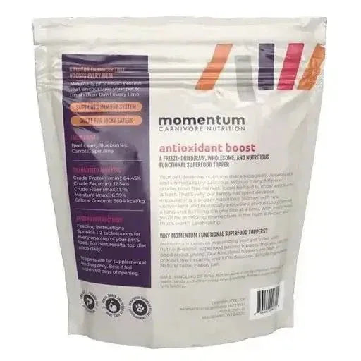 Back of Momentum Carnivore Nutrition 3oz Antioxidant Boost freeze-dried raw dog food topper bag with nutritional facts.
