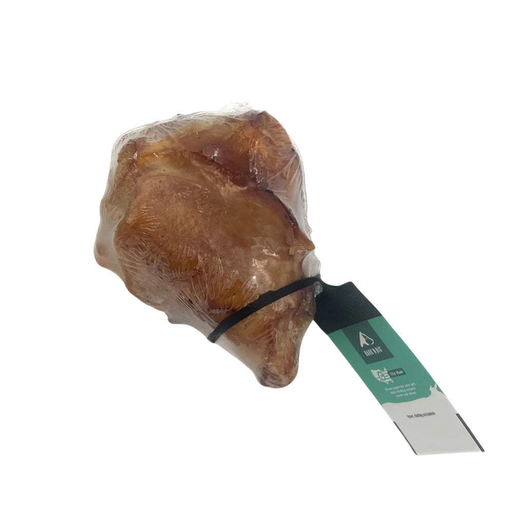 Talis Us BarknBig Beef Knee Cap Dog Treat Chew, packaged, suitable for small and medium breed dogs.