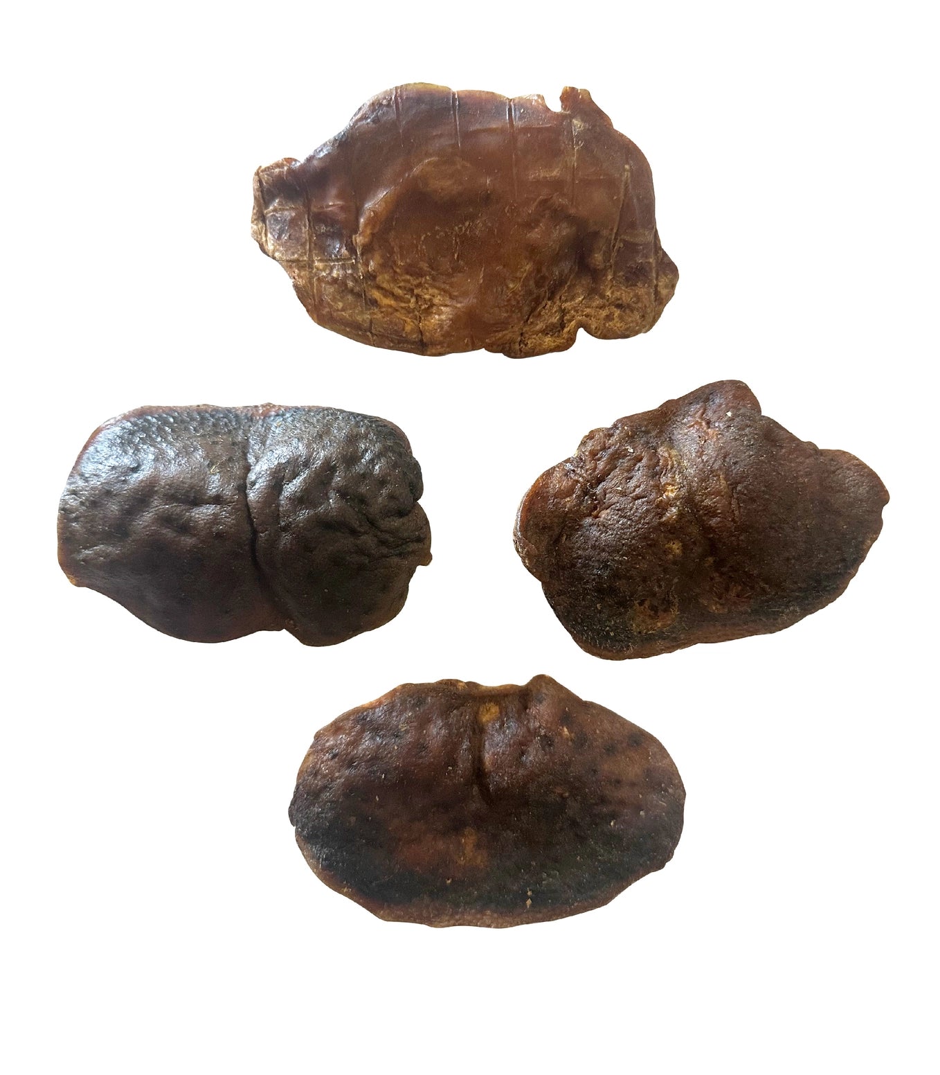 Four pieces of dark brown, textured water buffalo chin dog chew treats on a white background.