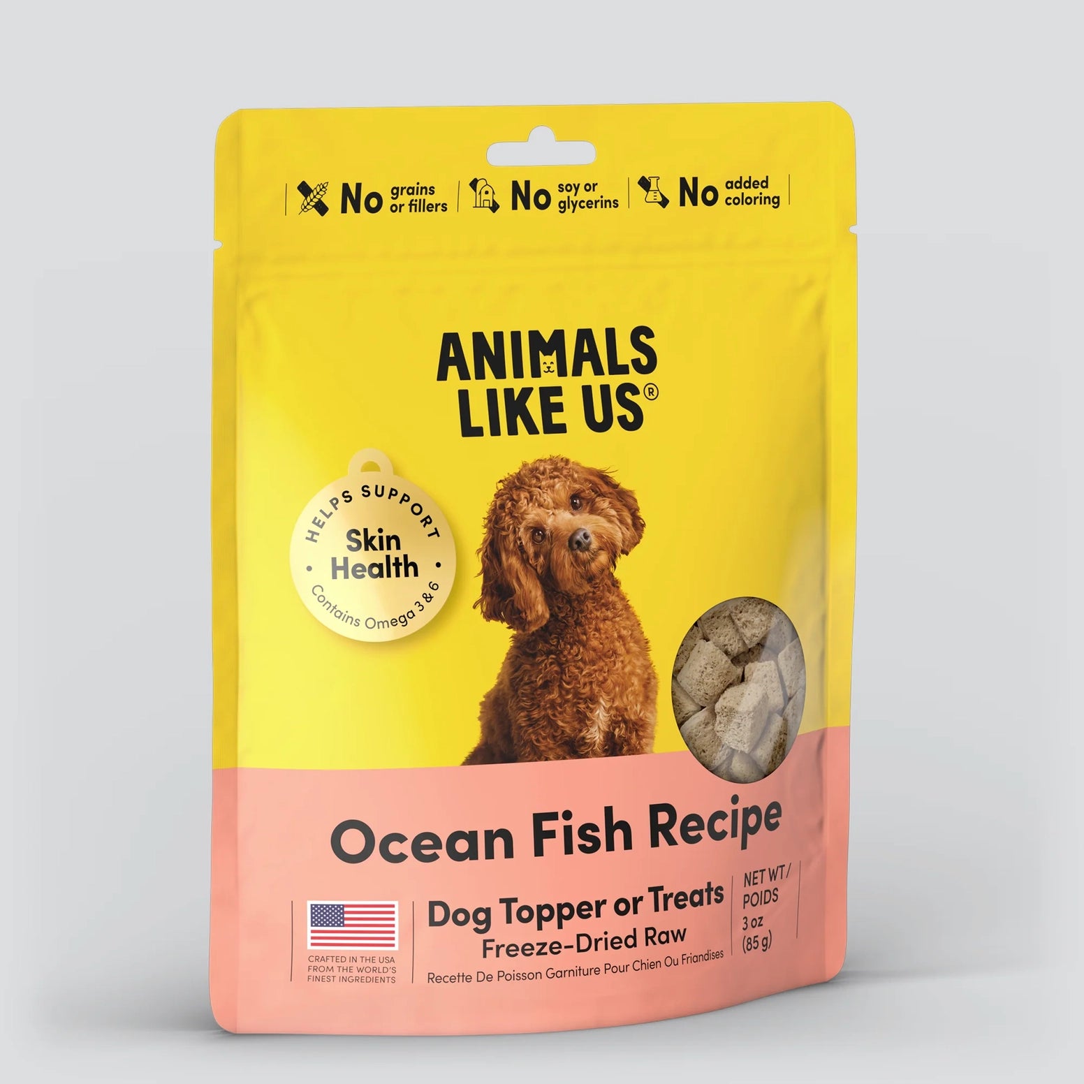 Animals Like Us Ocean Fish Recipe freeze-dried raw dog food topper in a yellow and pink 3 oz bag.