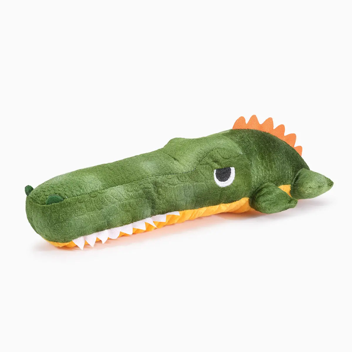 Hugsmart Pet Jungle Tails crocodile plush dog toy with green body, orange belly, and white teeth.