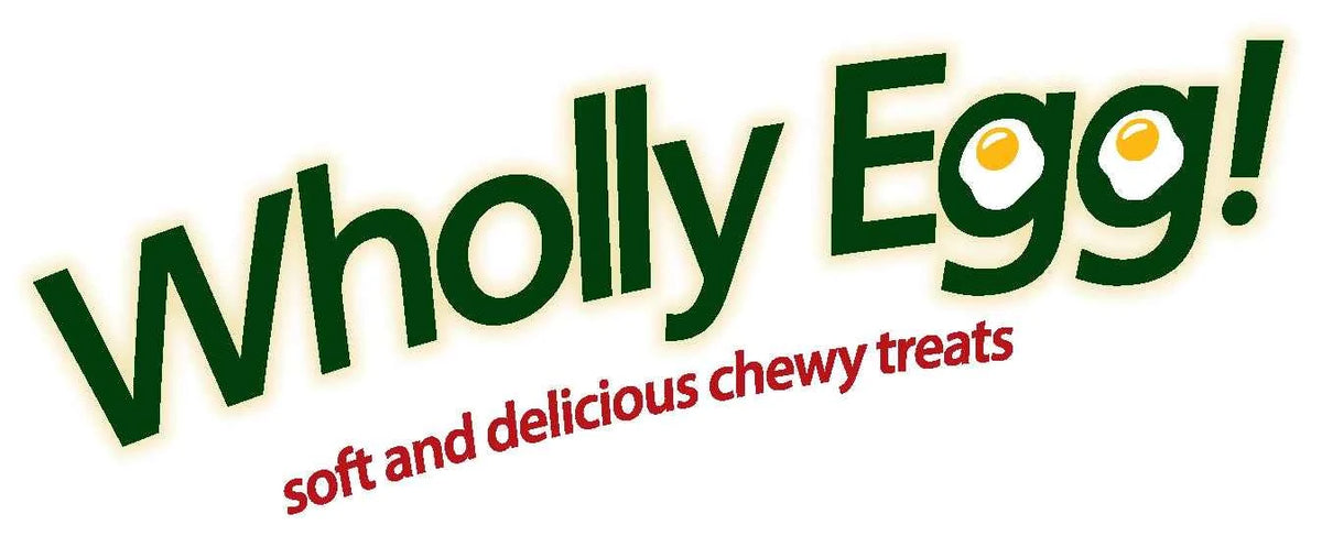 Logo for Emerald Pet Wholly Egg cat treats featuring green text and egg-shaped graphics.