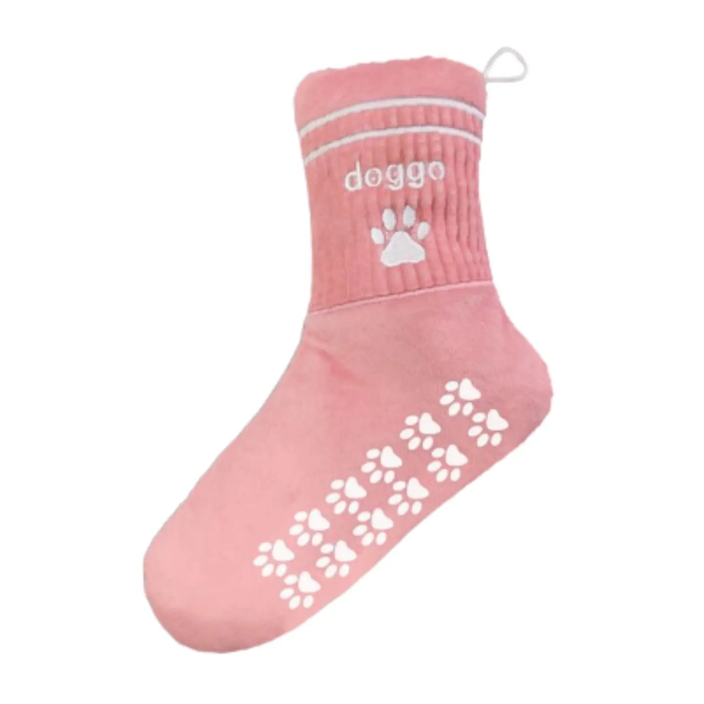 Pink dog sock with white paw print grips and 'doggo' text, non-slip pet accessory