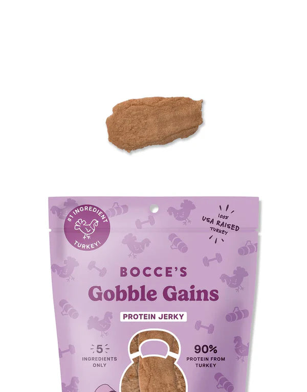 Bocce's Bakery Gobble Gains Jerky Protein Cuts 5oz package with a single jerky piece above it, featuring a purple design.