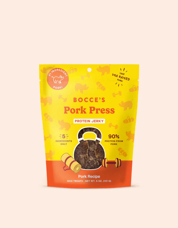 Bocce's Bakery Pork Jerky Dog Treats 5oz package featuring a vibrant yellow design with a pork graphic and clear product labe