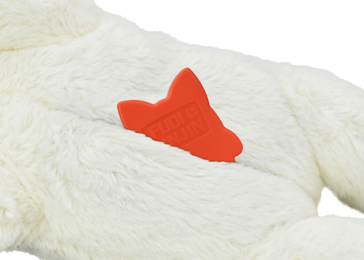 Creamy white plush dog toy with a red rubber heartbeat squeaker for interactive comfort and play