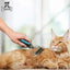 A person grooms a fluffy orange cat lying down with the Talis Us Pet Dematting Comb for Dogs, featuring an ergonomic handle. The relaxed cat looks content, and the Talis Us brand logo appears in the top left corner.