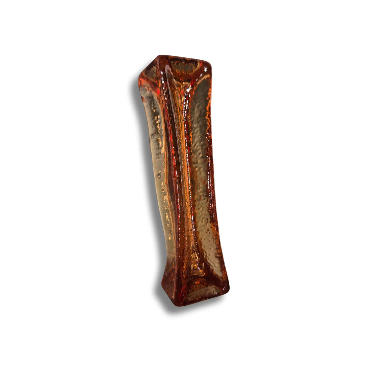 A single long-lasting amber-colored collagen dental chew for dogs with a textured surface.