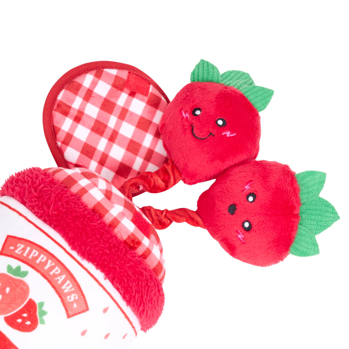Soft red plush strawberry jar dog toy with gingham lid and two smiling strawberry attachments on bungee cords