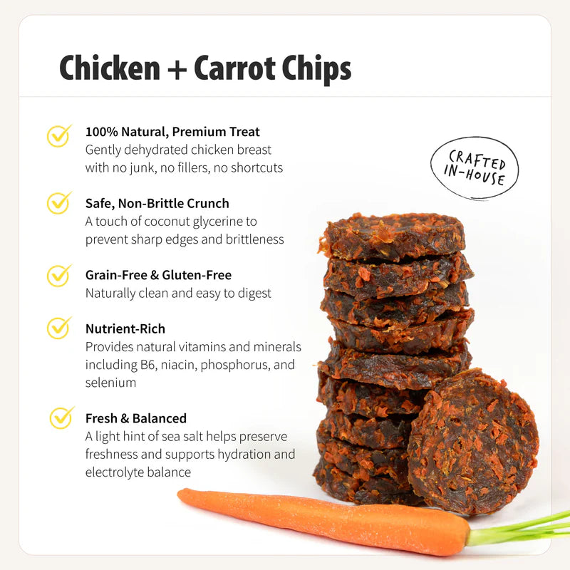 Stack of round orange-brown chicken and carrot dog treats next to a fresh carrot and product benefits listed nearby