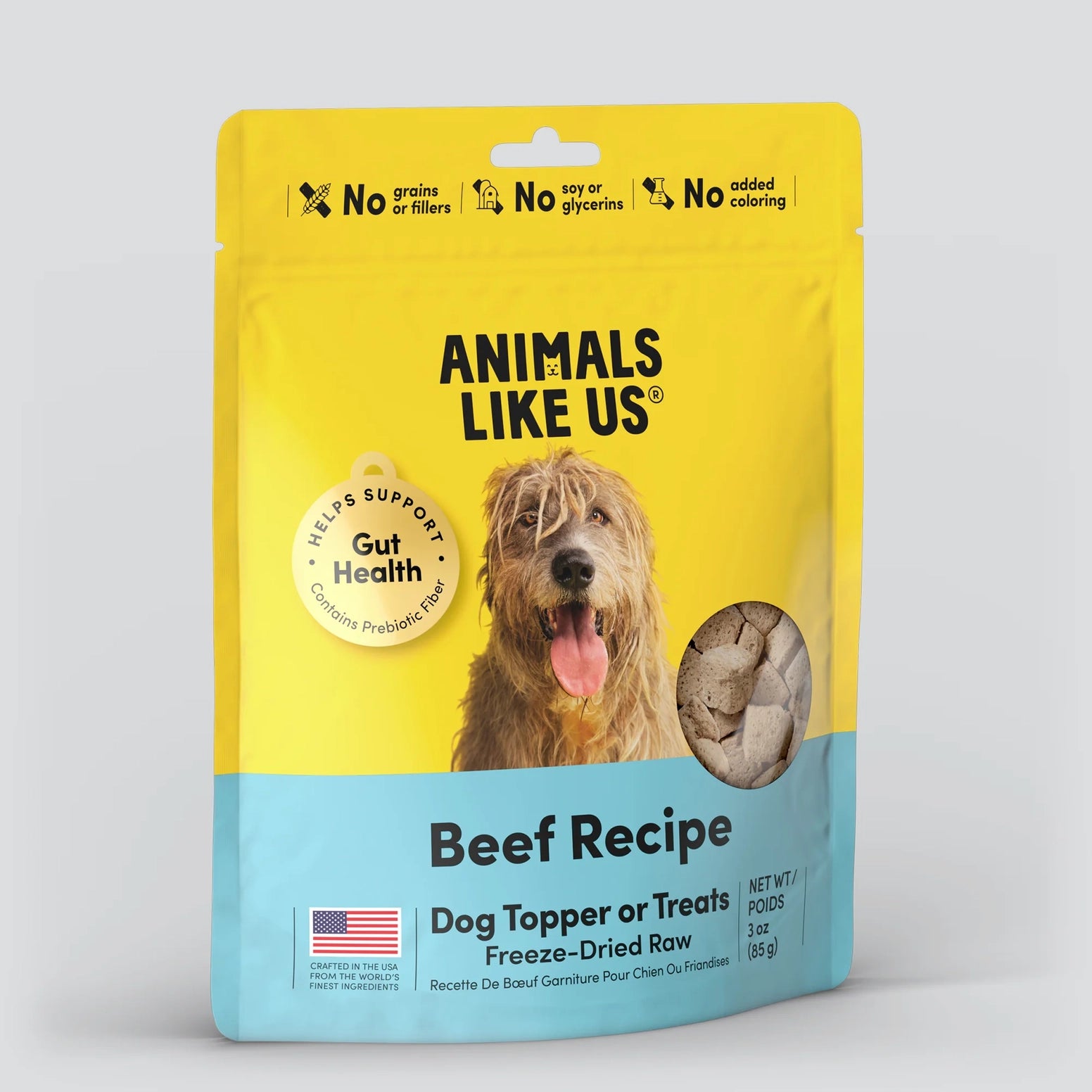 Yellow and blue bag of freeze-dried beef dog topper with dog image and gut health benefits on front packaging