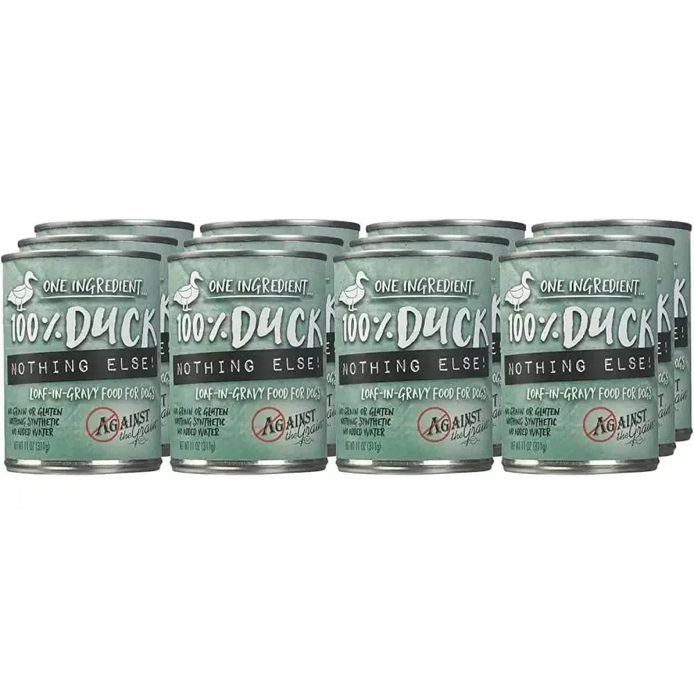 Twelve cans of Against the Grain Nothing Else One Ingredient Duck Dog Food, 11-oz each, are arranged in two rows. The silver and green cans with duck graphics offer simple nutrition—ideal for dogs needing limited ingredients.