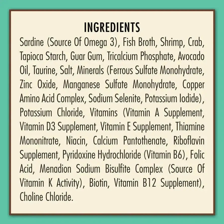 AvoDerm Grain Free Sardine Shrimp & Crab Entree in Gravy Canned Cat Food 24/3oz lists sardine, fish broth, shrimp, crab, vitamins, minerals, and supplements on a cream-colored box with bold black Ingredients at the top.
