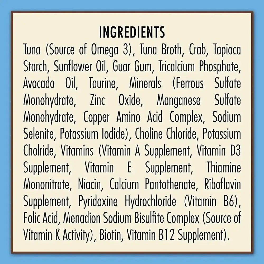 The ingredients label for AvoDerm Grain Free Tuna & Crab Entree in Gravy Canned Cat Food 24ea lists tuna, crab, tapioca starch, sunflower oil, vitamins, and minerals on a beige background with a blue border.