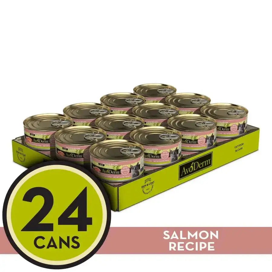 AvoDerm Natural Salmon Formula Wet Cat Food, 24 cans (5.5 oz each), comes in a yellow tray with green AvoDerm branding, bold 24 CANS label, and cans featuring gold lids and pink labels.