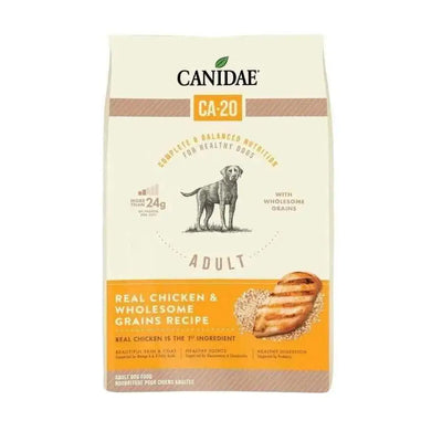 A beige and orange bag of CANIDAE CA-20 Real Chicken Recipe with Wholesome Grains Dry Dog Food is shown, featuring a dog illustration and images of grilled chicken and grains.