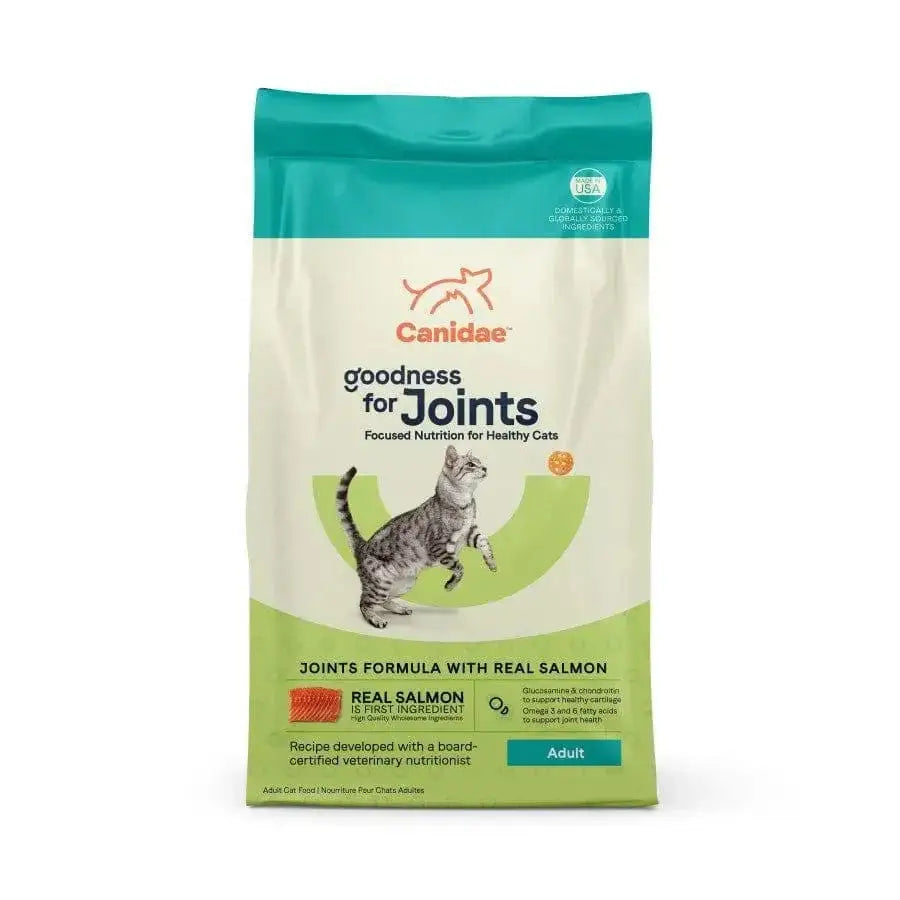 A bag of CANIDAE Goodness for Joints Formula with Real Salmon Dry Cat Food, showing a gray tabby cat and highlighting support for healthy adult cats. The cream and green CANIDAE packaging features blue and orange accents.