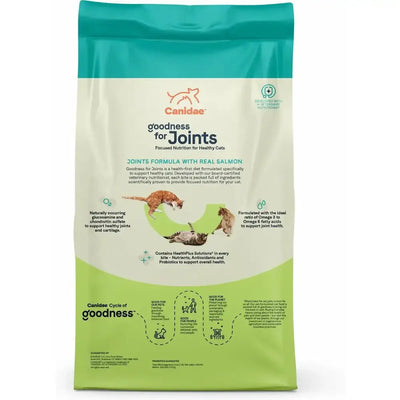 A bag of CANIDAE Goodness for Joints Formula with Real Salmon Dry Cat Food features green and cream colors, a cartoon cat logo, images of active cats, and highlights joint health benefits for healthy adult cats.