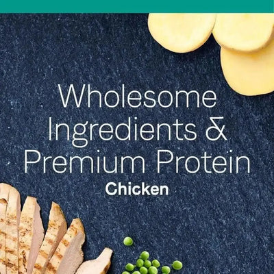 Grilled chicken, green peas, and potato slices spotlight CANIDAE PURE Elements Formula with Chicken Limited Ingredient Dry Cat Food—premium, grain free nutrition. Wholesome Ingredients & Premium Protein. Chicken featured at the center.