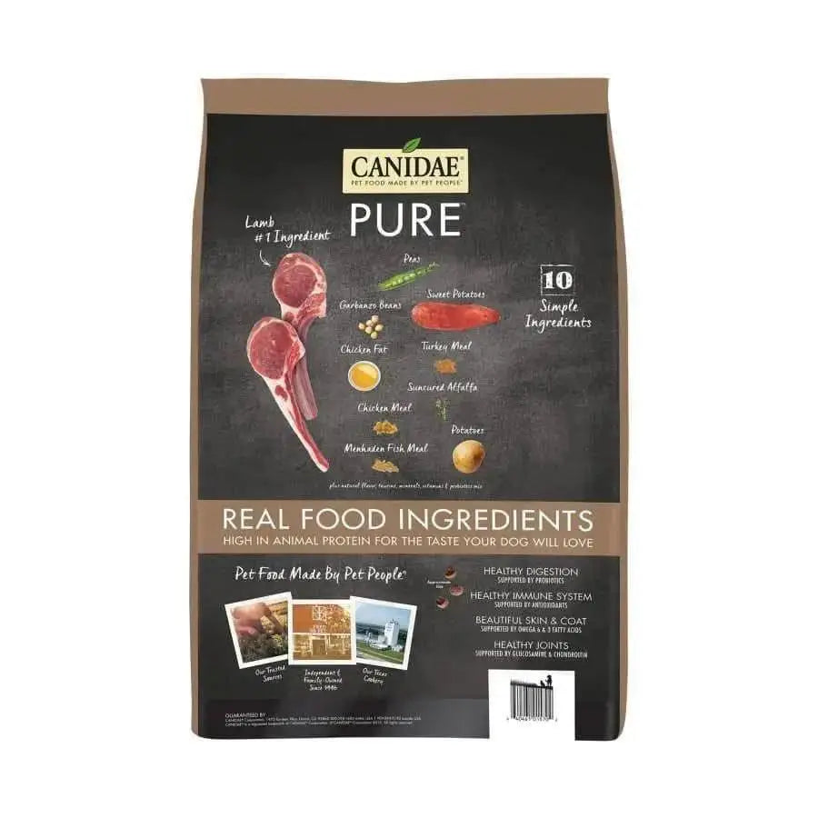 A bag of CANIDAE PURE Grain-Free Real Lamb & Pea Recipe Dry Dog Food features real lamb, peas, and sweet potatoes on the packaging, which highlights 10 simple ingredients for healthy digestion and immune support.