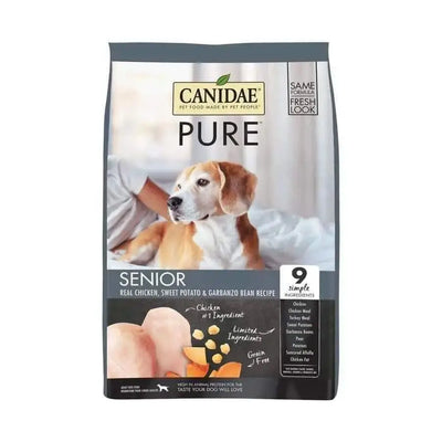 A bag of CANIDAE PURE Grain-Free Senior Real Chicken Sweet Potato & Garbanzo Bean Recipe Dry Dog Food features a dog on a bed and highlights its grain-free, limited ingredient formula with chicken, sweet potato, and garbanzo beans.