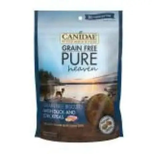 A bag of CANIDAE PURE Heaven Grain-Free Biscuits with Duck & Chickpeas, a limited ingredient dog treat, featuring the CANIDAE brand’s scenic lake, trees, and sunset design on the packaging.