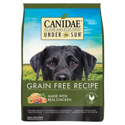 A bag of CANIDAE Under The Sun Grain-Free Chicken Recipe Dry Dog Food with a black dog’s face, green background, and text showcasing real chicken, farm-grown ingredients, fruits, and vegetables.