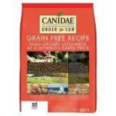 A red bag of CANIDAE Under The Sun Grain-Free Lamb Recipe Dry Dog Food features farm crop images and highlights Farm-Grown Goodness at a Down-to-Earth Price, made with quality farm-grown ingredients.