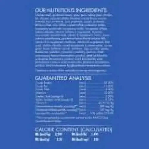 A blue label with white text highlights CANIDAE Under The Sun Grain-Free Large Breed Chicken Recipe Dry Dog Food’s single animal protein ingredients. The label also lists a nutrient table and calorie info, but the text is mostly unreadable.