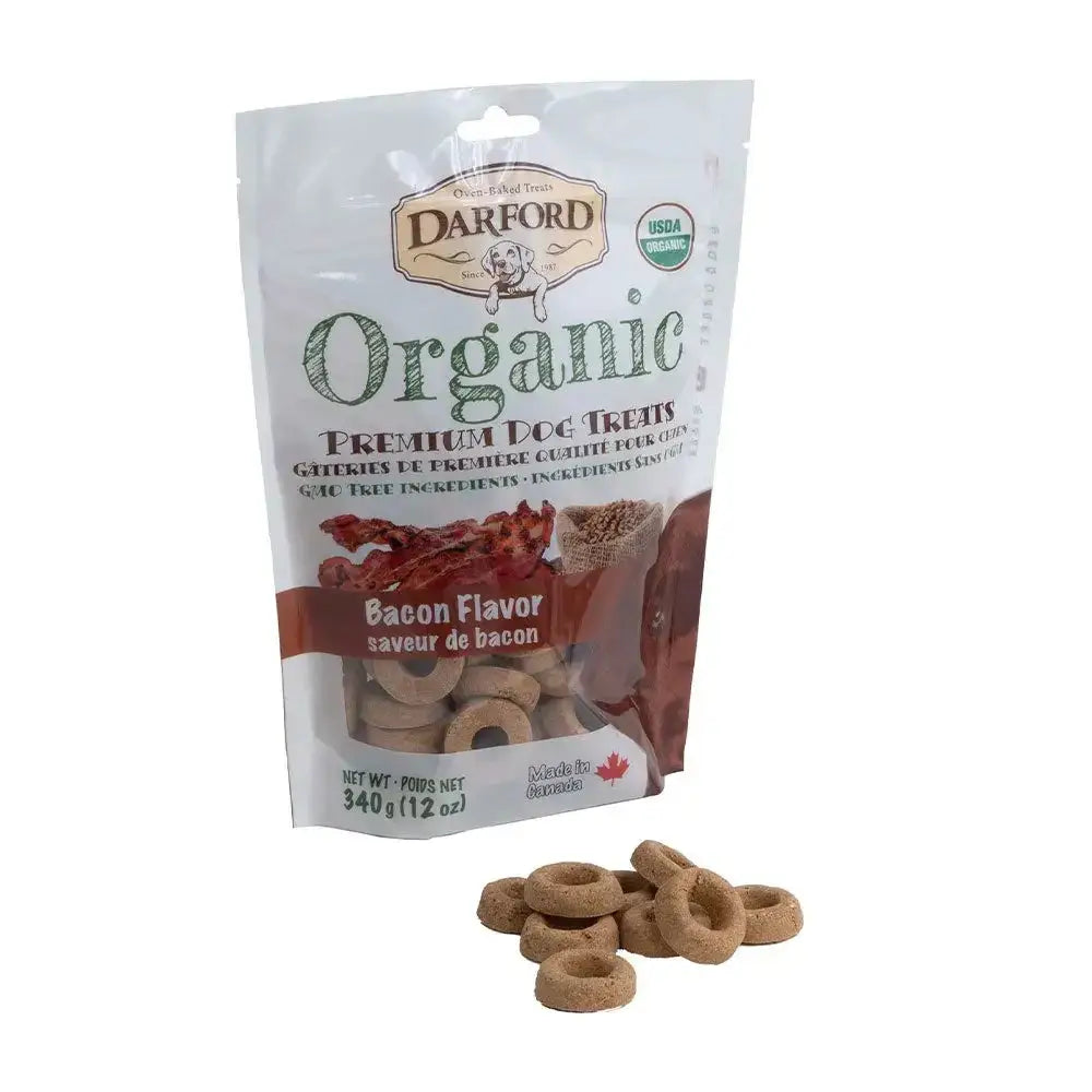A bag of Darford® Organic Premium Bacon Flavor Dog Treat (340 g/12 oz) is shown with several round, brown treats in front. The white packaging with green and red accents features the USDA Organic seal and the Darford brand name.