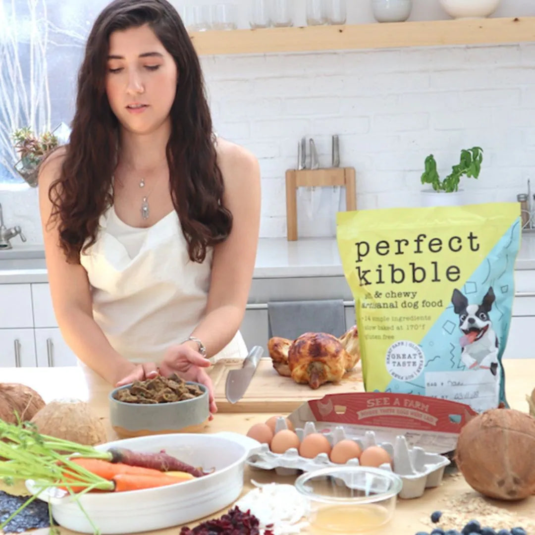 Yumwoof Gut Health Beef Pot Roast Dog Food shown as brown air-dried kibble in a bowl beside its bag and fresh ingredients.