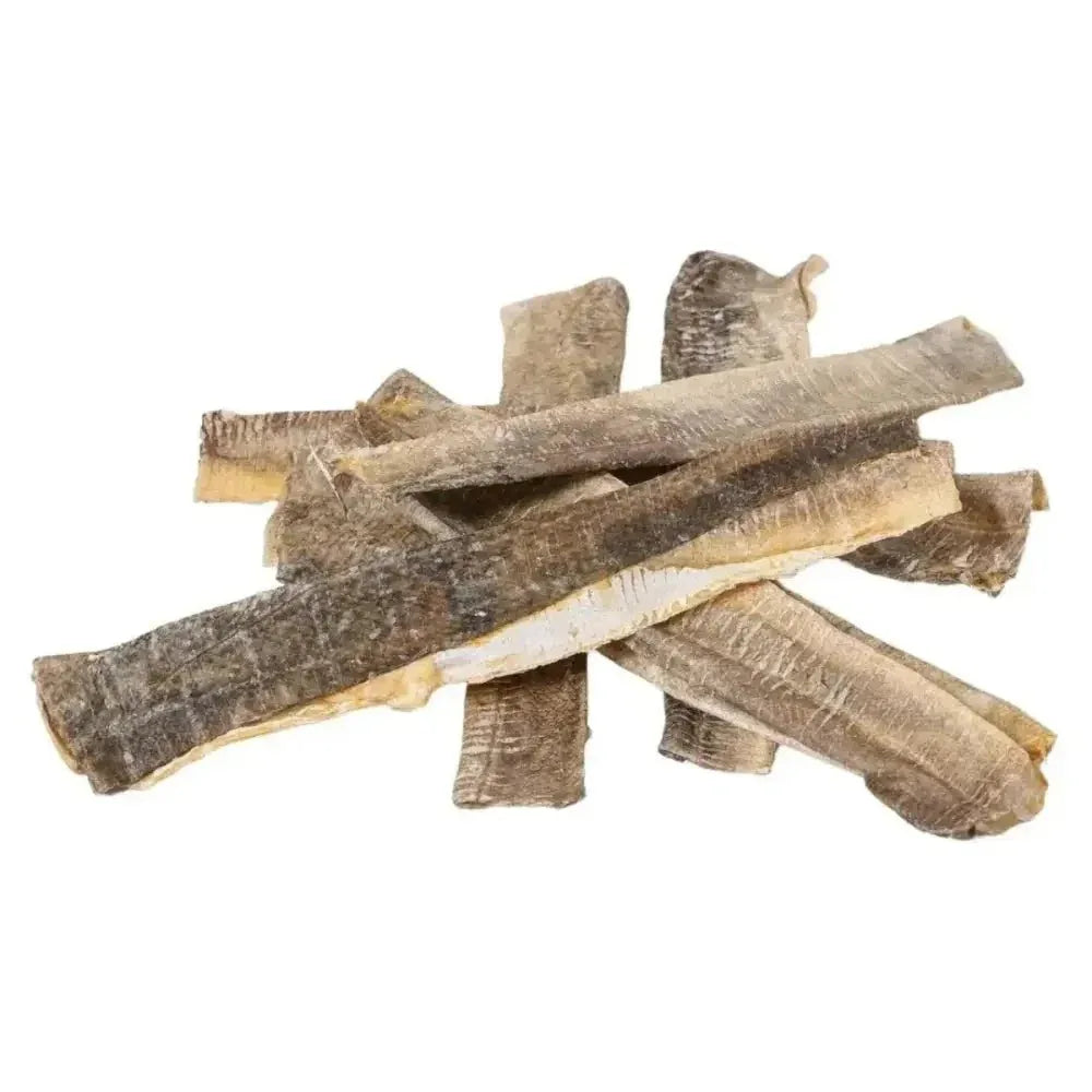 Stack of air-dried Icelandic cod flattie dog chews showing natural skin texture on a clean white background.