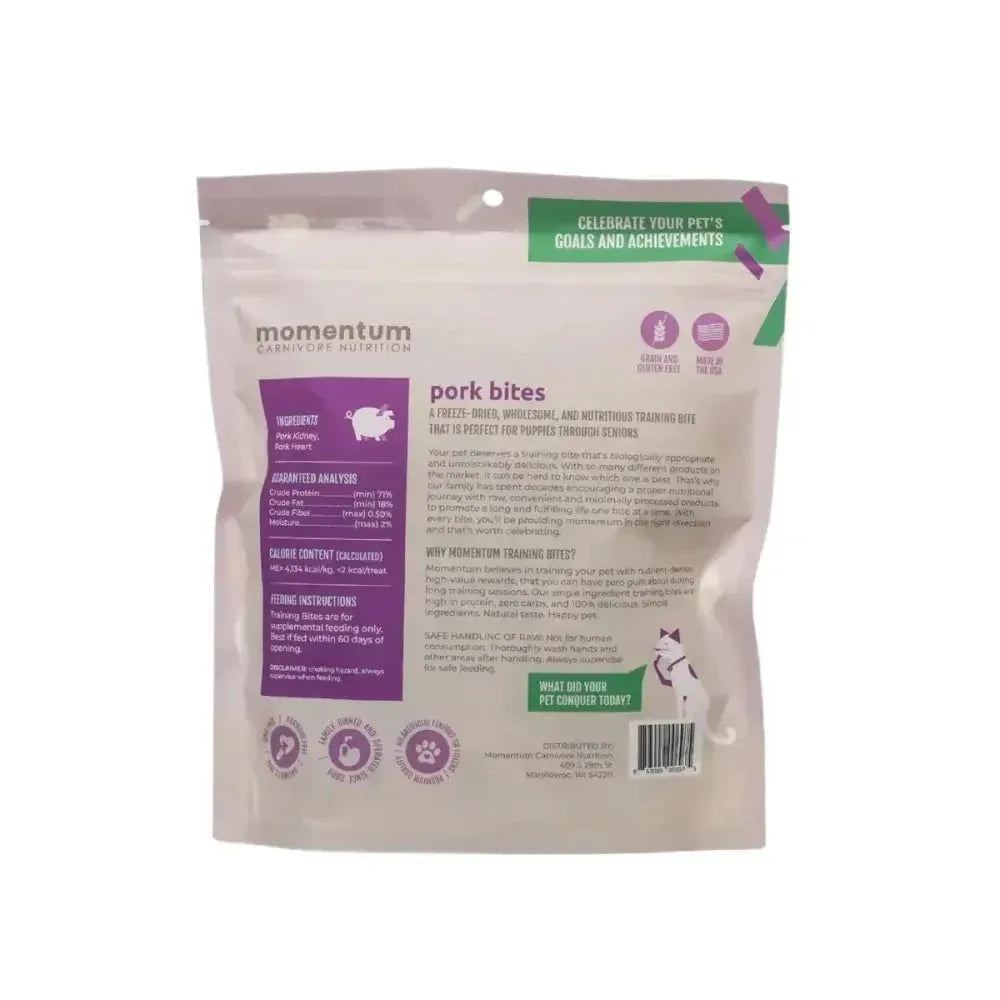Back view of Momentum Carnivore Nutrition Pork Bites bag showing grain-free ingredients and nutritional info for dog treats.