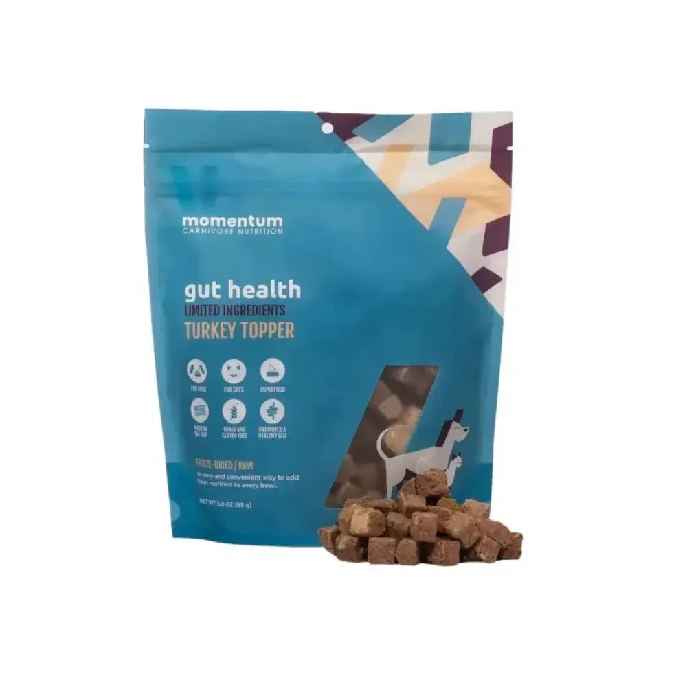 3oz bag of Momentum Gut Health Turkey Topper for dogs and cats with freeze-dried raw meat cubes on a white background.