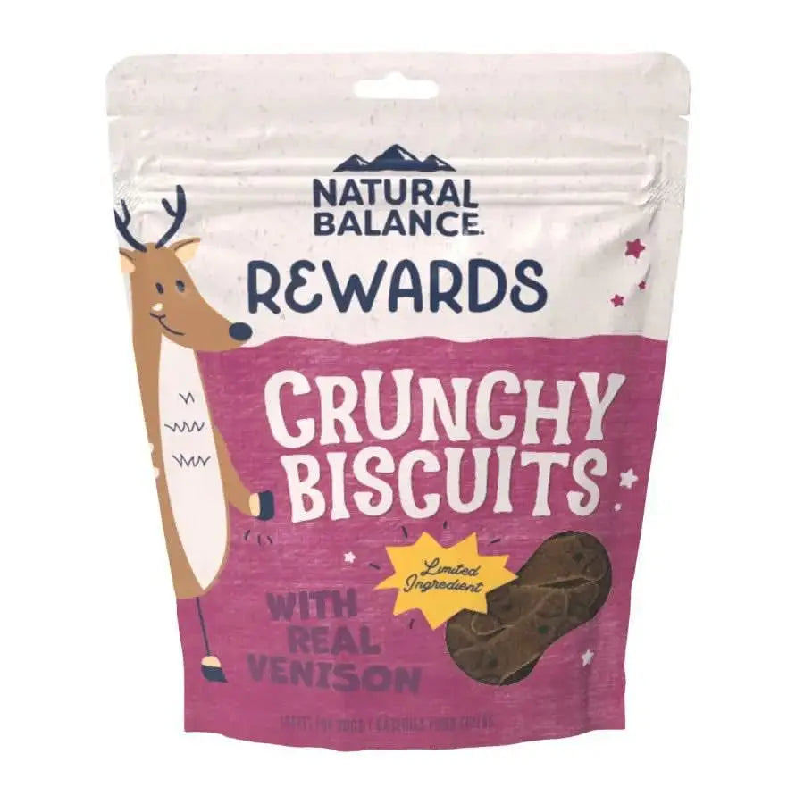 A bag of Natural Balance CPD L.I.T. Venison & Sweet Potato Original Biscuits Dog Treats in a pink and beige pack with a cartoon deer; grain-free, perfect for limited ingredient diets, featuring tasty biscuits.