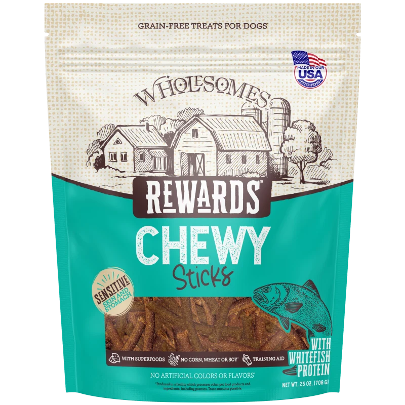 Talis Us Wholesomes Chewy Whitefish Dog Treats in a 25 oz bag, featuring a farm scene and a fish graphic. Grain-free, sensiti