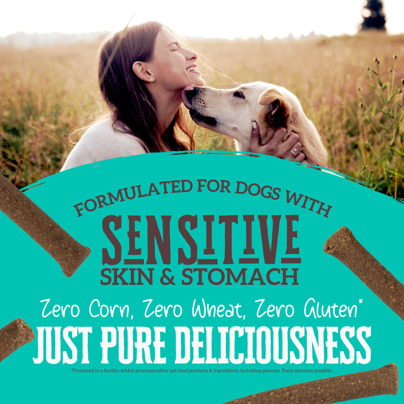 Talis Us Wholesomes Chewy Whitefish Dog Treats in a vibrant package, featuring a woman and her dog, highlighting sensitive sk