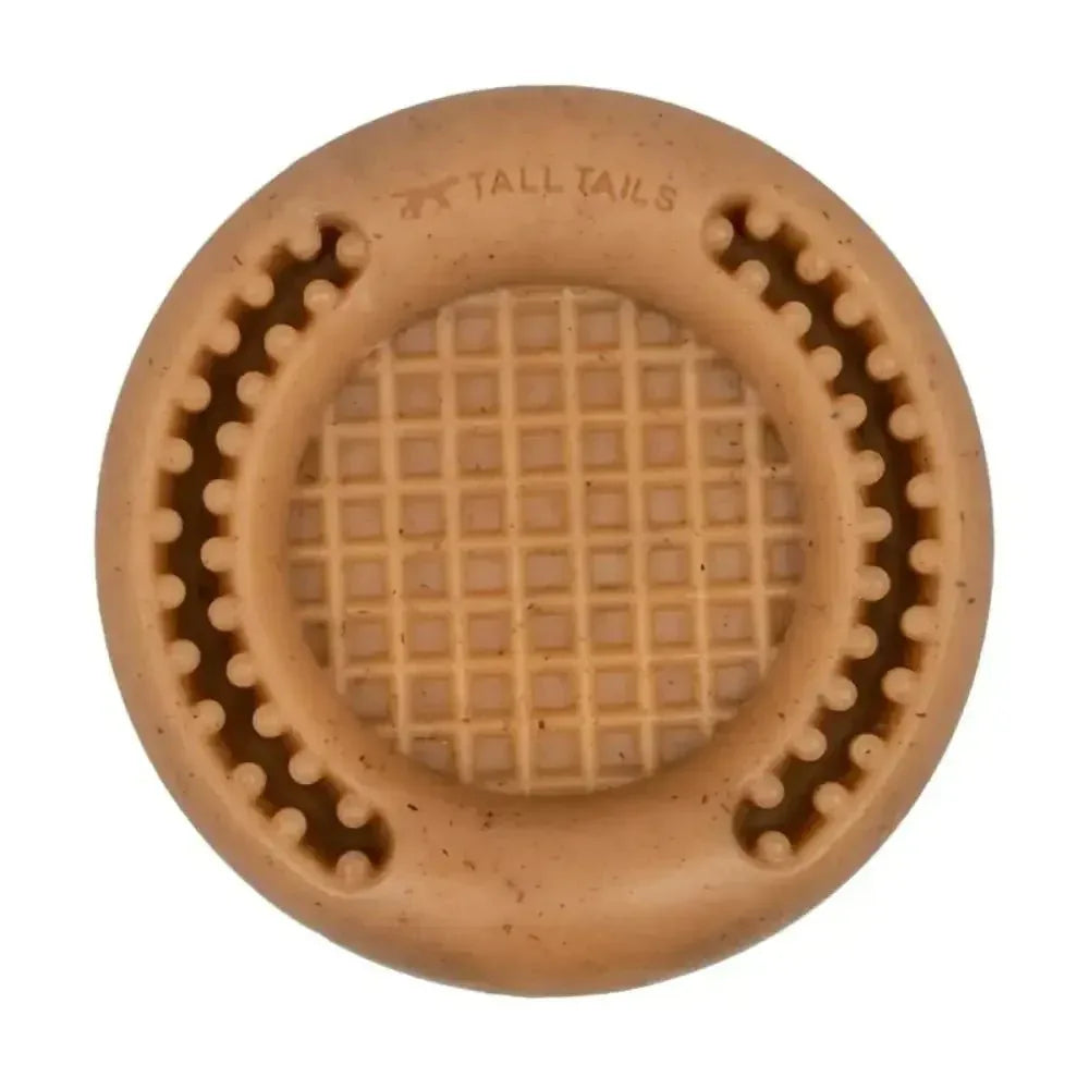 Tall Tails Wiggle Waffle Chew Dog Toy in tan with a waffle-textured center and treat troughs.
