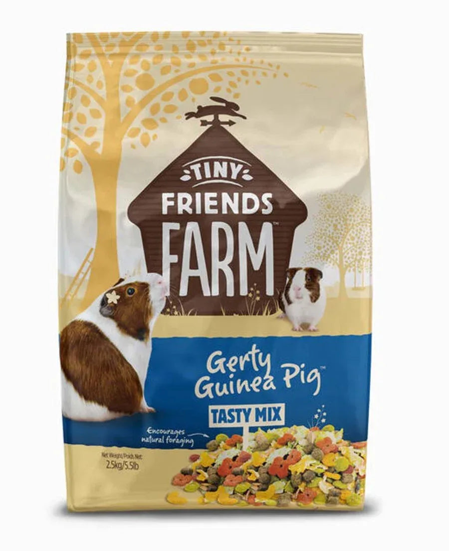 Dry guinea pig tasty mix by Tiny Friends Farm with guinea pigs and ingredient images on packaging.