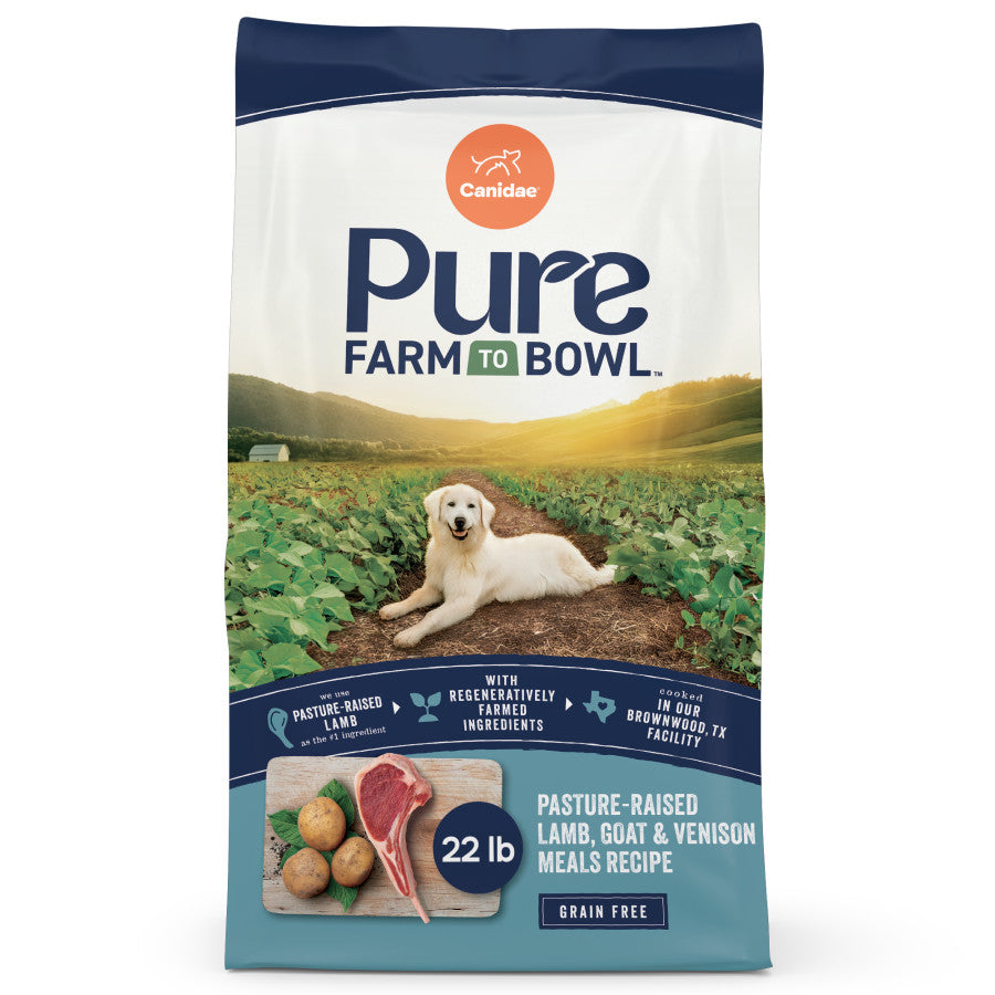 Talis Us CANIDAE PURE Grain-Free Dry Dog Food bag featuring real lamb, goat, and venison, 22 lb, with a dog and farm backgrou